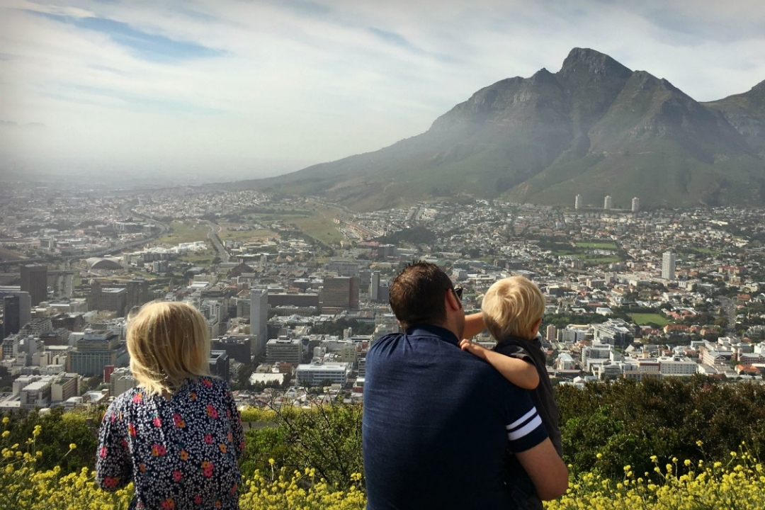 young kids with dad overlooking to the city of Cape Town, South Africa